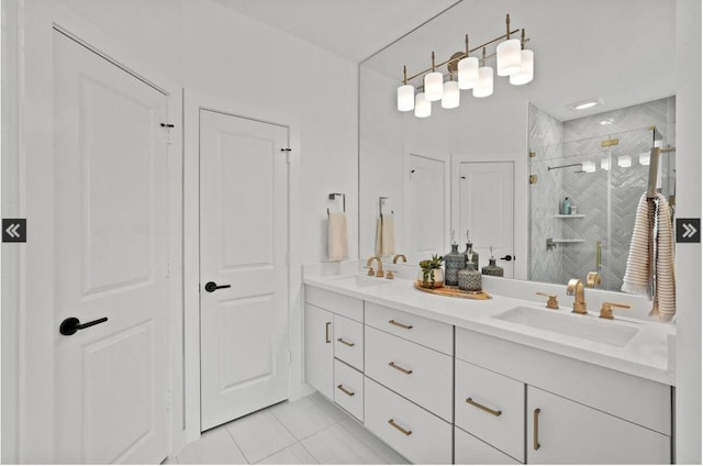 bathroom featuring double vanity, a shower stall, a sink, and tile patterned floors