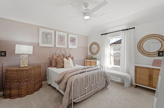 carpeted bedroom with lofted ceiling and ceiling fan