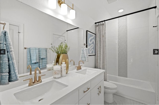 full bathroom with toilet, tile patterned flooring, a sink, and shower / bath combo with shower curtain