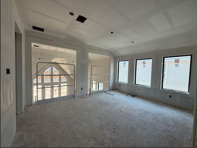 unfurnished room with visible vents