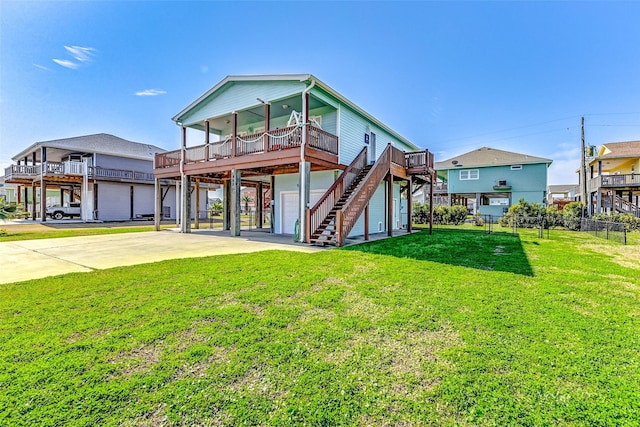 view of front facade with a garage, fence, stairs, driveway, and a front yard