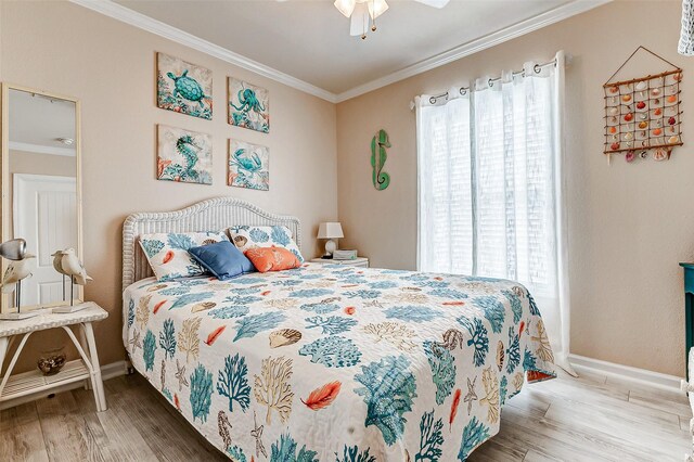 bedroom with multiple windows, wood finished floors, and crown molding