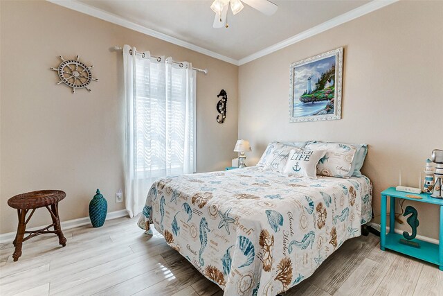 bedroom featuring baseboards, wood finished floors, a ceiling fan, and crown molding