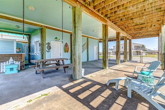 view of patio featuring a gate and fence