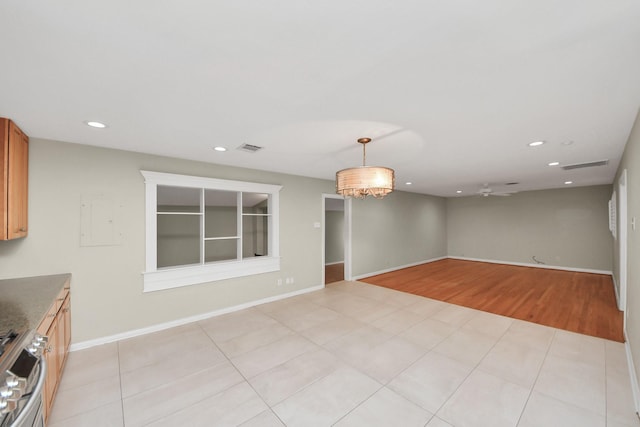 interior space featuring light tile patterned flooring, visible vents, and recessed lighting