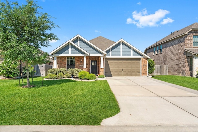 craftsman house featuring an attached garage, fence, and brick siding