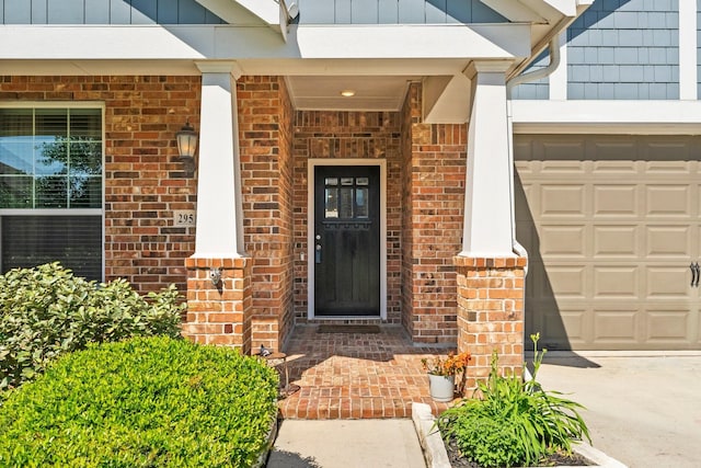 doorway to property with brick siding and board and batten siding