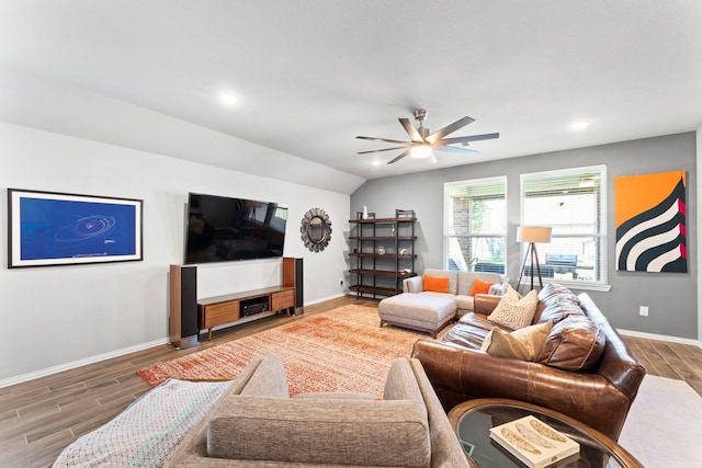 living area featuring ceiling fan, lofted ceiling, recessed lighting, wood finish floors, and baseboards