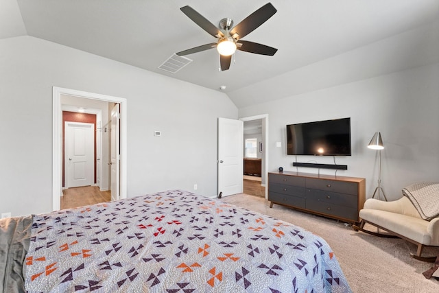 carpeted bedroom with lofted ceiling, ceiling fan, and visible vents