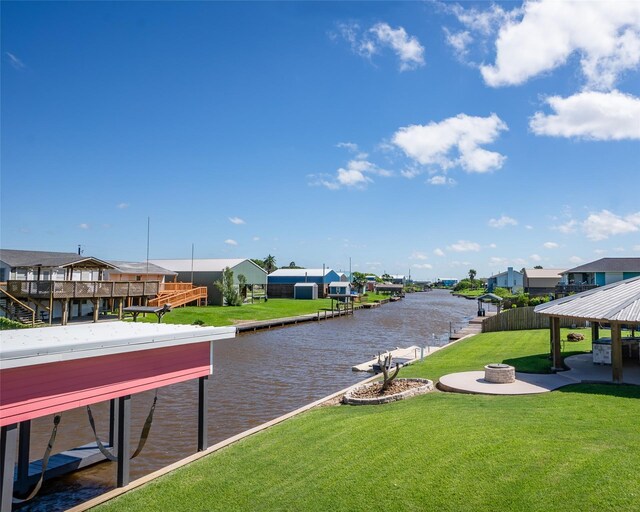 632 County Road 204, Sargent, TX 77414 - exterior space featuring an outdoor fire pit, a water view, a residential view, and a dock