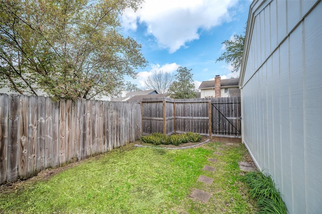 view of yard featuring a fenced backyard