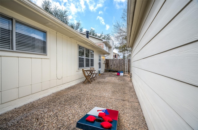 view of patio / terrace featuring fence