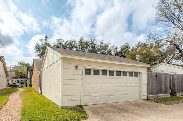 garage with fence