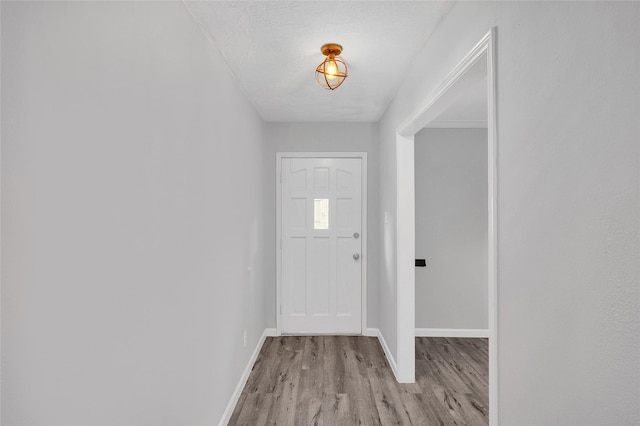 3048 Gessner Rd, Houston, TX 77080 - foyer with wood finished floors, baseboards, and a textured ceiling