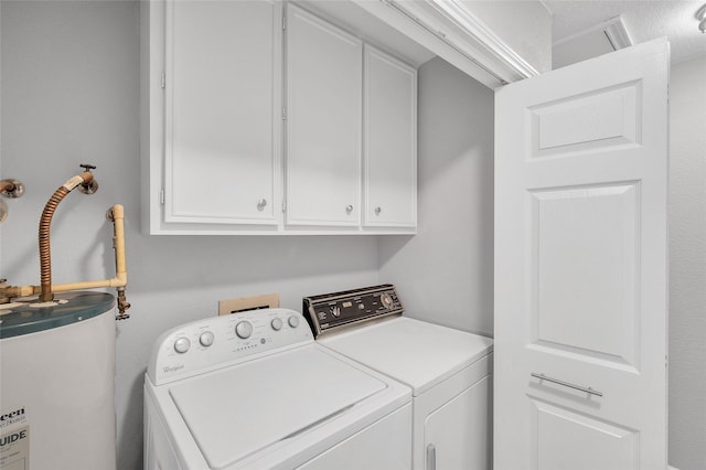 3048 Gessner Rd, Houston, TX 77080 - laundry room featuring cabinet space, washer and clothes dryer, and water heater