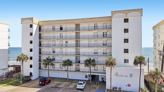 view of building exterior featuring uncovered parking