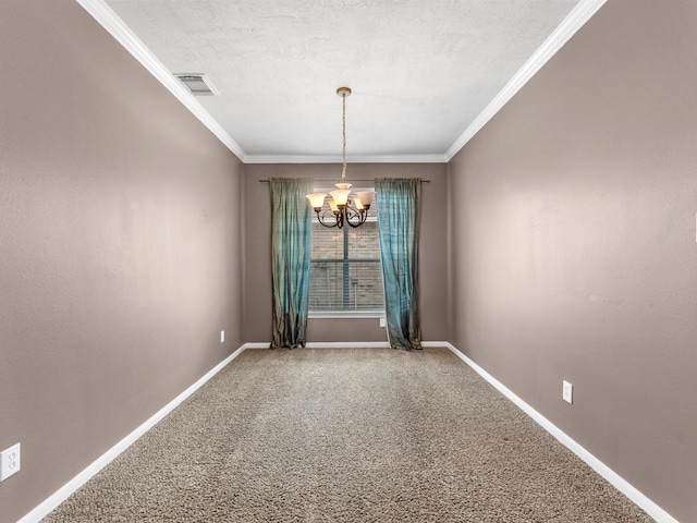 spare room featuring ornamental molding, visible vents, a notable chandelier, and baseboards