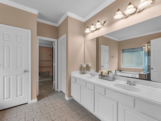 bathroom featuring ornamental molding, a garden tub, a sink, and tile patterned floors