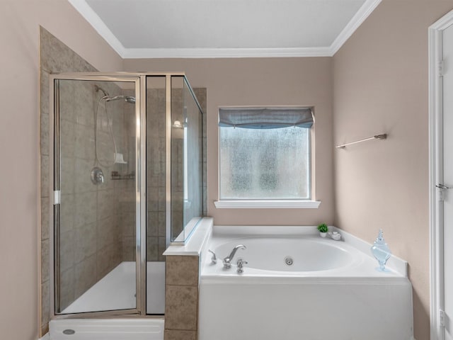 bathroom with ornamental molding, a stall shower, and a garden tub