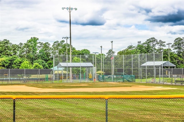 surrounding community featuring a tennis court and fence