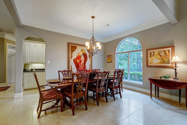 37314 Edgewater Dr, Pinehurst, TX 77362 - dining area with crown molding, a chandelier, baseboards, and light tile patterned flooring