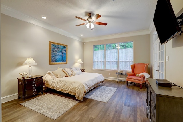 37314 Edgewater Dr, Pinehurst, TX 77362 - bedroom featuring ornamental molding, wood finished floors, baseboards, recessed lighting, and a ceiling fan