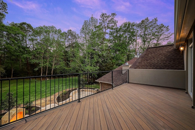 37314 Edgewater Dr, Pinehurst, TX 77362 - deck at dusk featuring a lawn