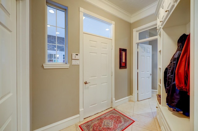 37314 Edgewater Dr, Pinehurst, TX 77362 - foyer entrance with crown molding, light tile patterned floors, and baseboards