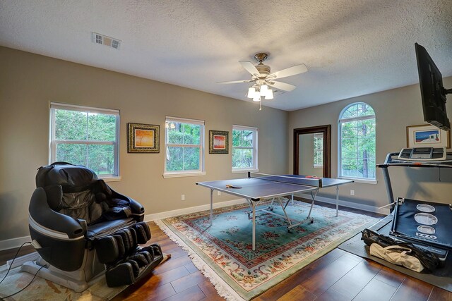 37314 Edgewater Dr, Pinehurst, TX 77362 - game room featuring plenty of natural light, baseboards, a ceiling fan, and a textured ceiling
