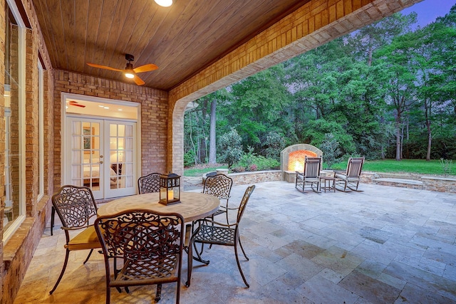 37314 Edgewater Dr, Pinehurst, TX 77362 - view of patio featuring french doors, outdoor dining space, and a ceiling fan
