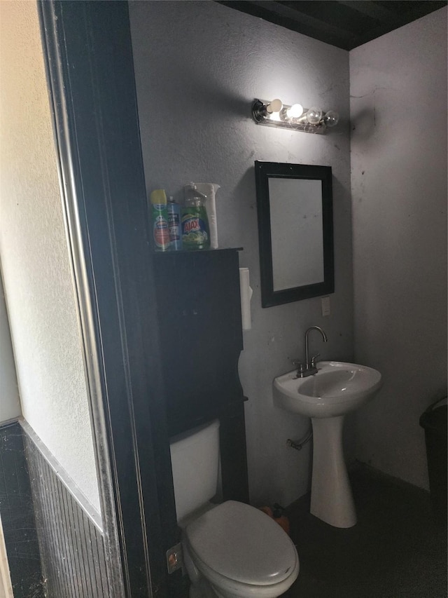 bathroom featuring toilet