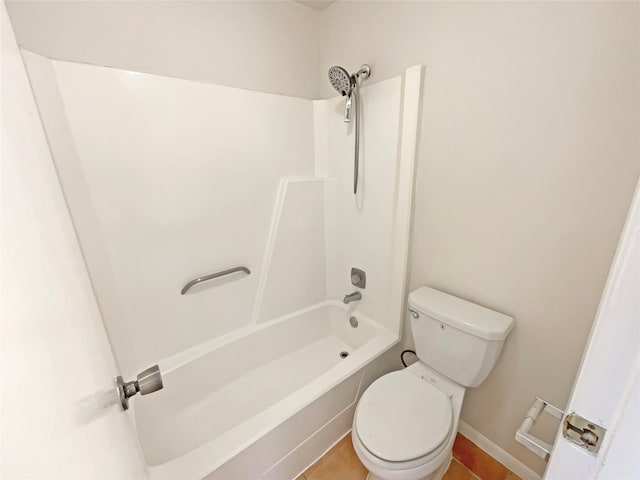 full bath with bathtub / shower combination, toilet, and tile patterned floors