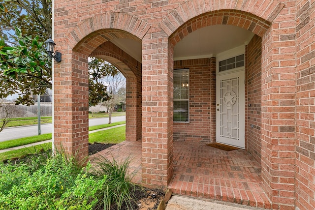 entrance to property with brick siding