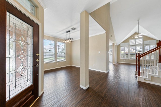 foyer featuring dark wood-type flooring, visible vents, plenty of natural light, and stairs