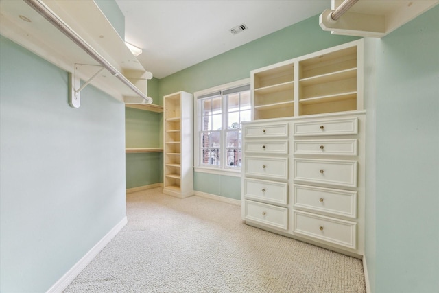 spacious closet featuring carpet flooring and visible vents