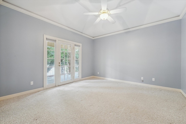 spare room with baseboards, a ceiling fan, ornamental molding, carpet flooring, and french doors