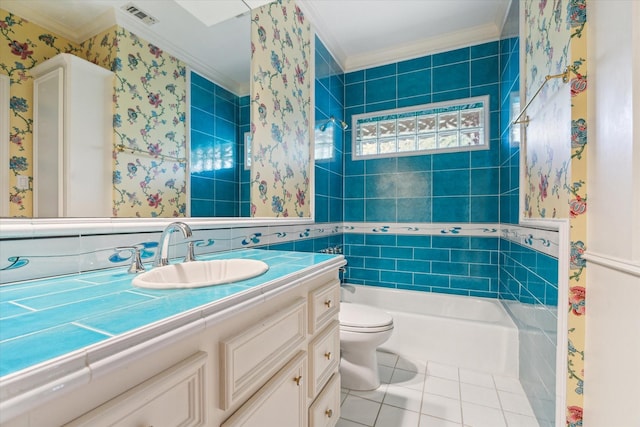 bathroom with visible vents, toilet, a bathing tub, tile patterned flooring, and crown molding