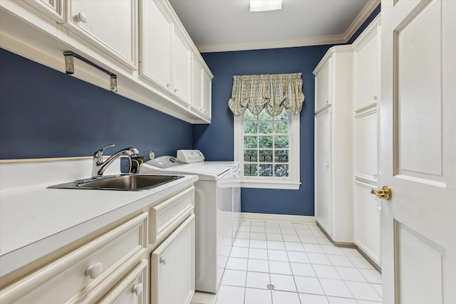 laundry room with cabinet space, light tile patterned floors, crown molding, washer and dryer, and a sink