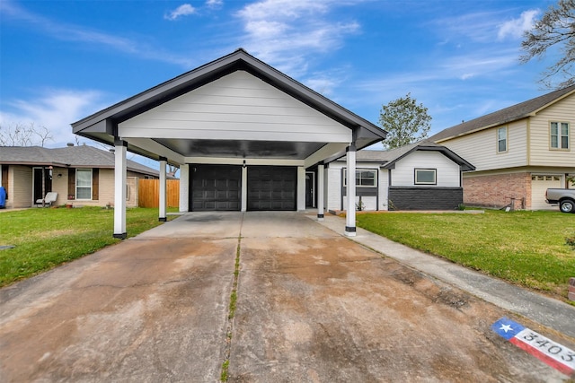 view of front of property featuring a garage, fence, driveway, a carport, and a front yard