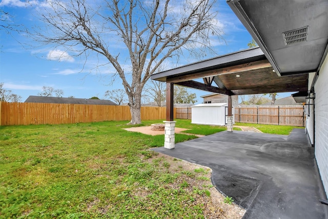 view of yard with a fenced backyard and a patio