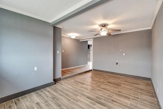 unfurnished room featuring ceiling fan, ornamental molding, baseboards, and wood finish floors