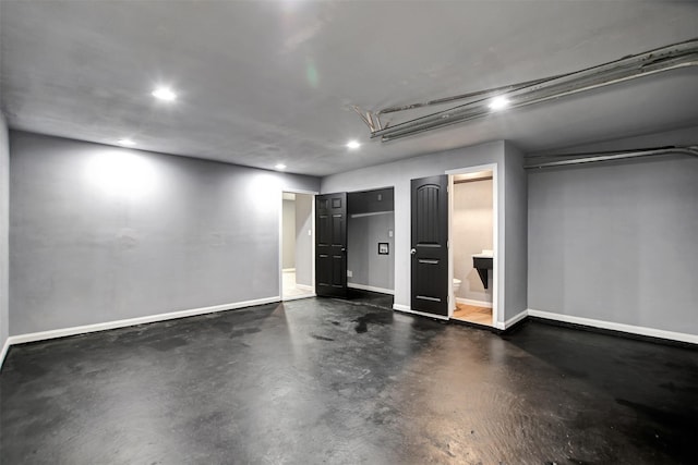 interior space with recessed lighting and baseboards