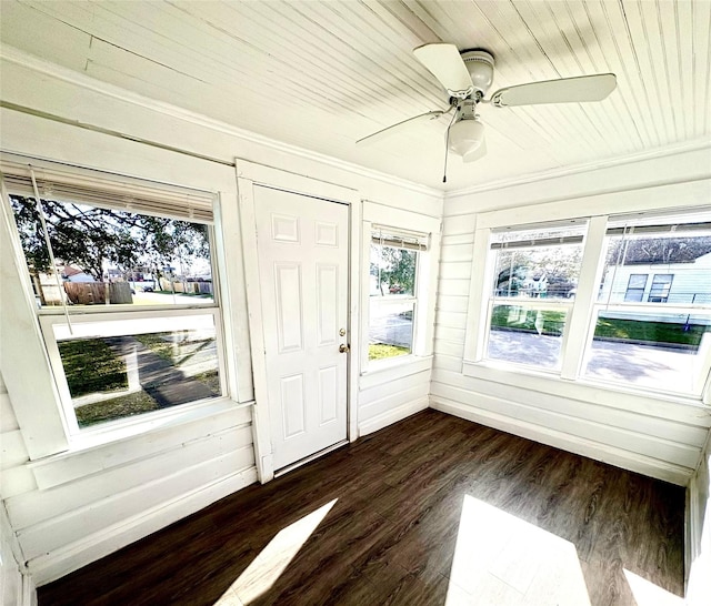 unfurnished sunroom with a ceiling fan and wooden ceiling