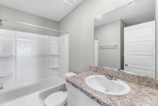 bathroom with visible vents, toilet, vanity, and shower / tub combination