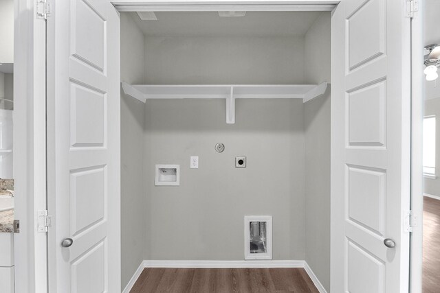 laundry area featuring laundry area, gas dryer hookup, dark wood-style flooring, hookup for a washing machine, and electric dryer hookup