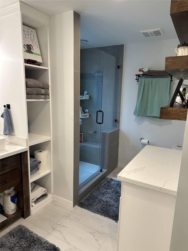 full bathroom with vanity, visible vents, baseboards, marble finish floor, and a shower stall