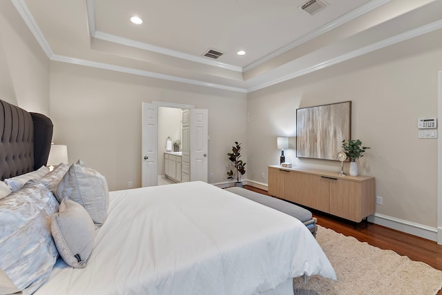 bedroom with recessed lighting, visible vents, ornamental molding, dark wood-style floors, and a tray ceiling