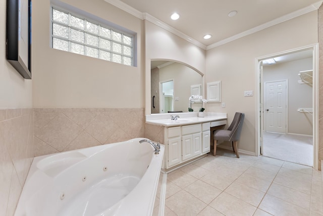 bathroom with ornamental molding, a tub with jets, tile patterned flooring, vanity, and recessed lighting