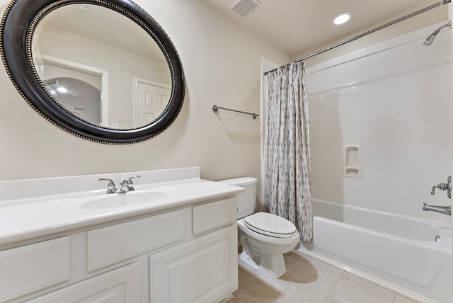 full bathroom with visible vents, toilet, shower / tub combo with curtain, tile patterned flooring, and vanity