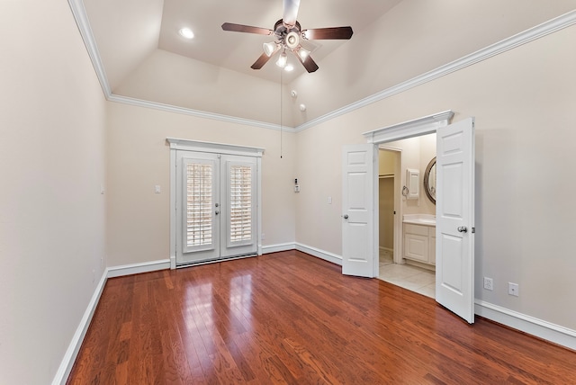 unfurnished bedroom with lofted ceiling, wood finished floors, french doors, baseboards, and access to exterior